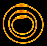 Set of three orange illuminated light up dog collars in small, medium, and large sizes nested together high visibility safety collars for walking in low light.