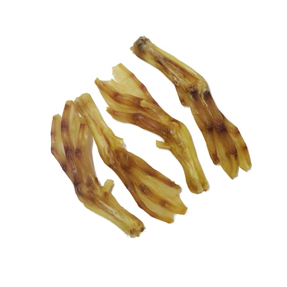 Four natural duck feet dog chews high protein air dried treats for teeth and gums and satisfying long lasting chewing.