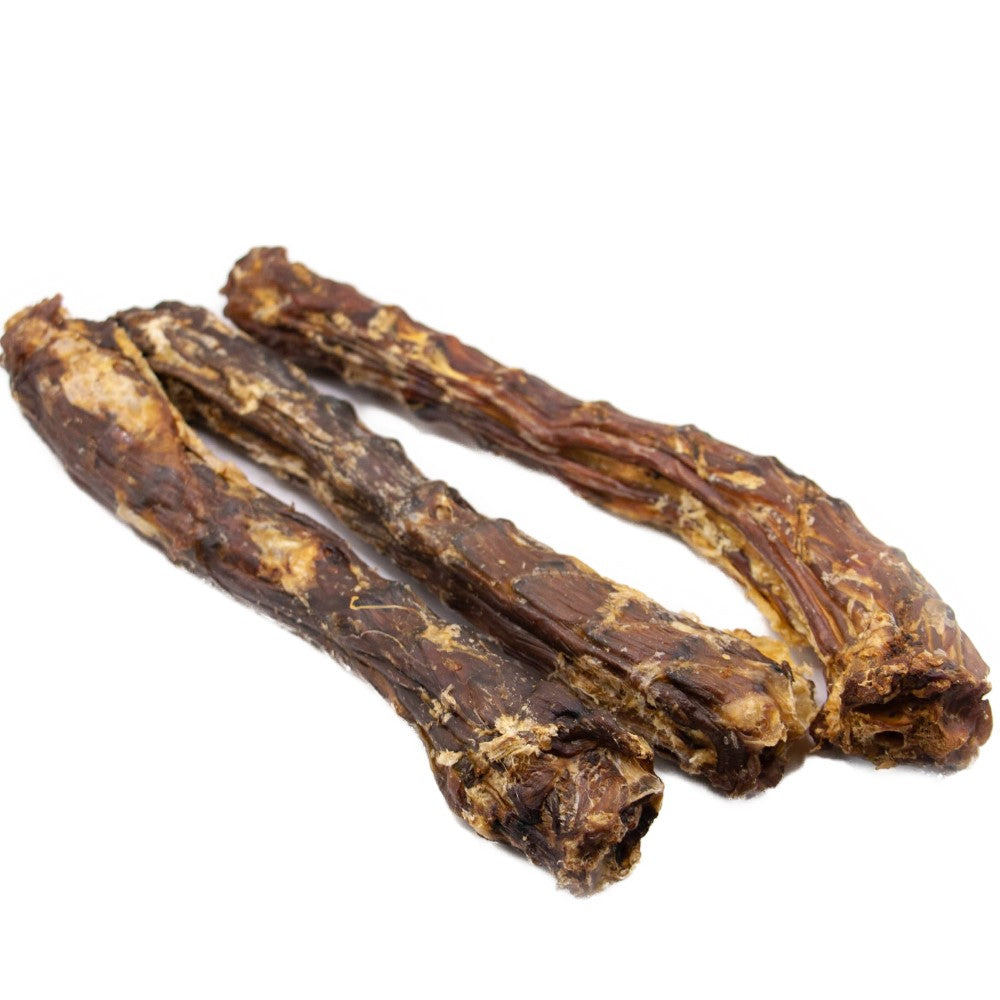 Three natural duck necks dog chews side by side high protein low fat long lasting treats for teeth and gums.