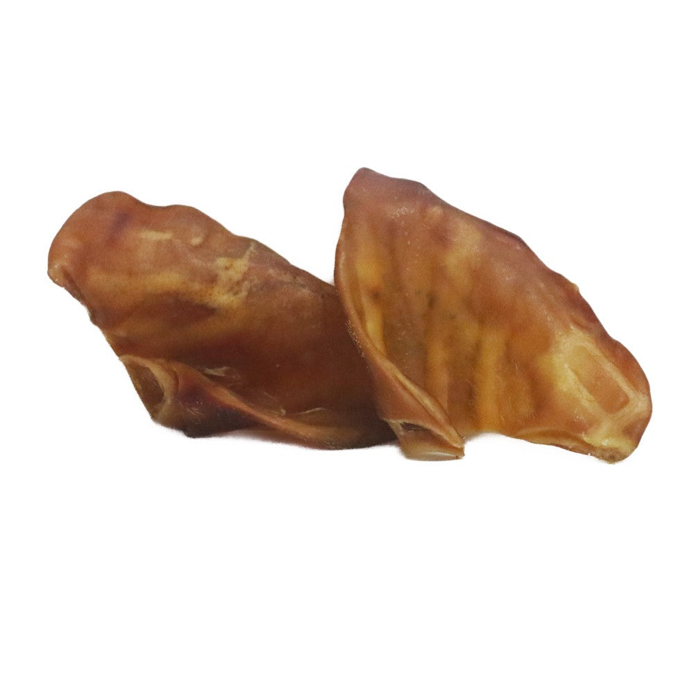 Two natural pigs ears dog chews high protein low fat long lasting treats for teeth and gums.